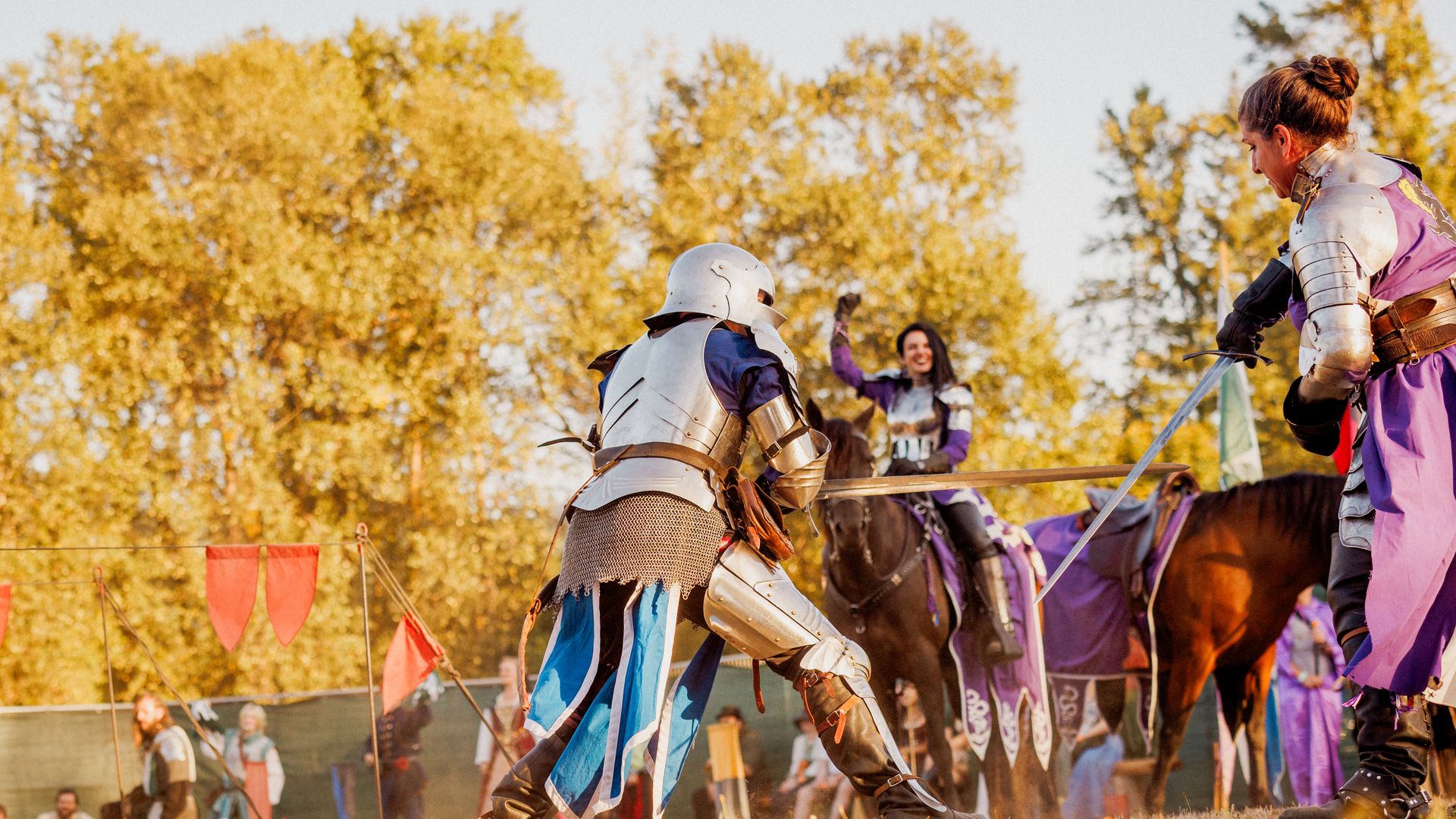 Knights in full armor jousting